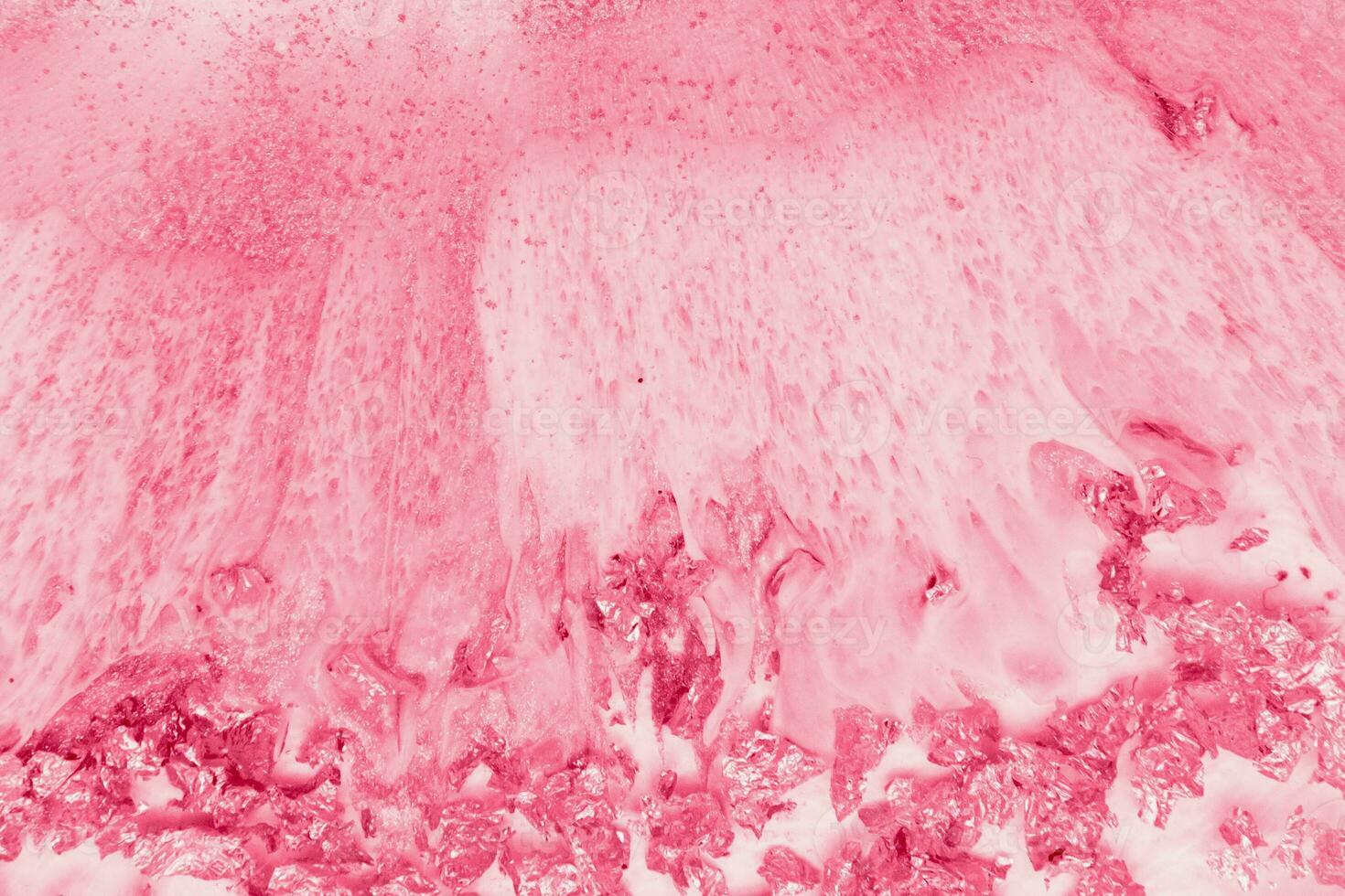 Spread-out acrylic paint. Abstract background, made in the technique of fluid art. Demonstrating the colors of 2023 - Viva Magenta photo