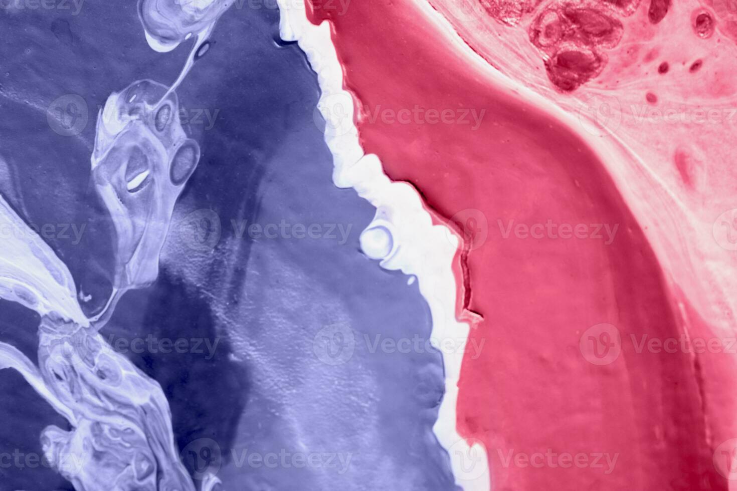 Spread-out acrylic paint. Abstract background, made in the technique of fluid art. Changing colors of the year concept. Very Peri and Viva Magenta. photo