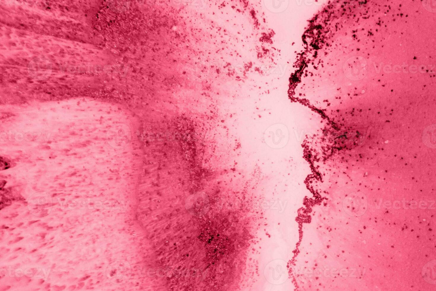 Spread-out acrylic paint. Abstract background, made in the technique of fluid art. Demonstrating the colors of 2023 - Viva Magenta photo