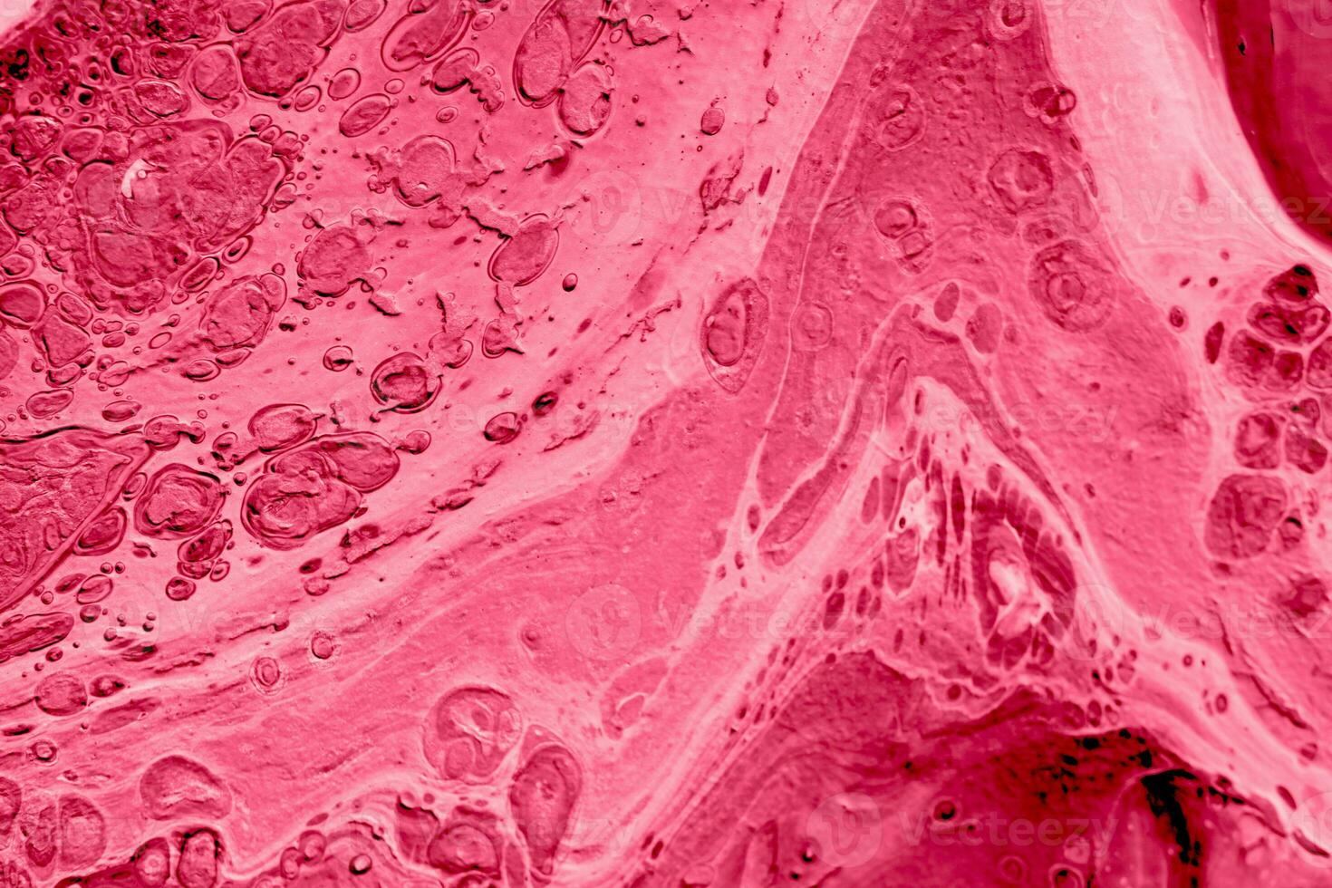 Spread-out acrylic paint. Abstract background, made in the technique of fluid art. Demonstrating the colors of 2023 - Viva Magenta photo