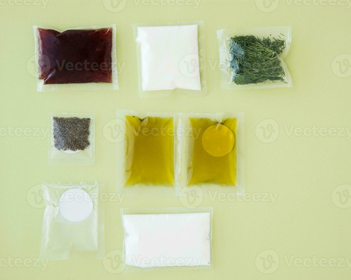 Set of spices, oils and sauces for cooking dinner. Set for delivery of food for dinner on a light background. Cooking at home, home cooking. photo