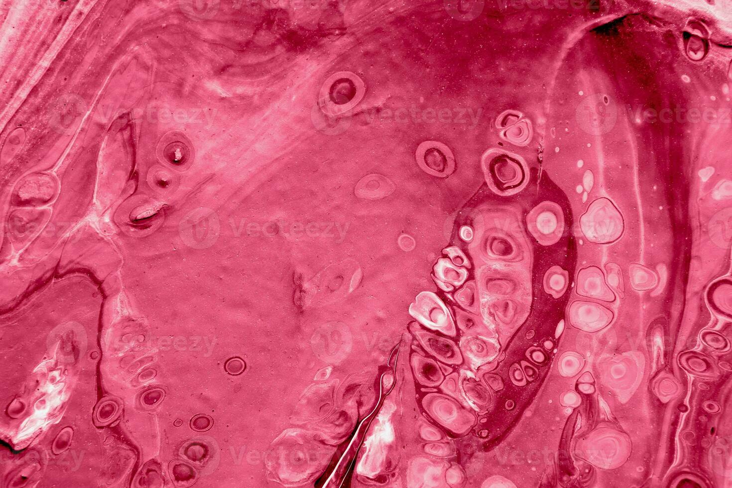 Spread-out acrylic paint. Abstract background, made in the technique of fluid art. Demonstrating the colors of 2023 - Viva Magenta photo
