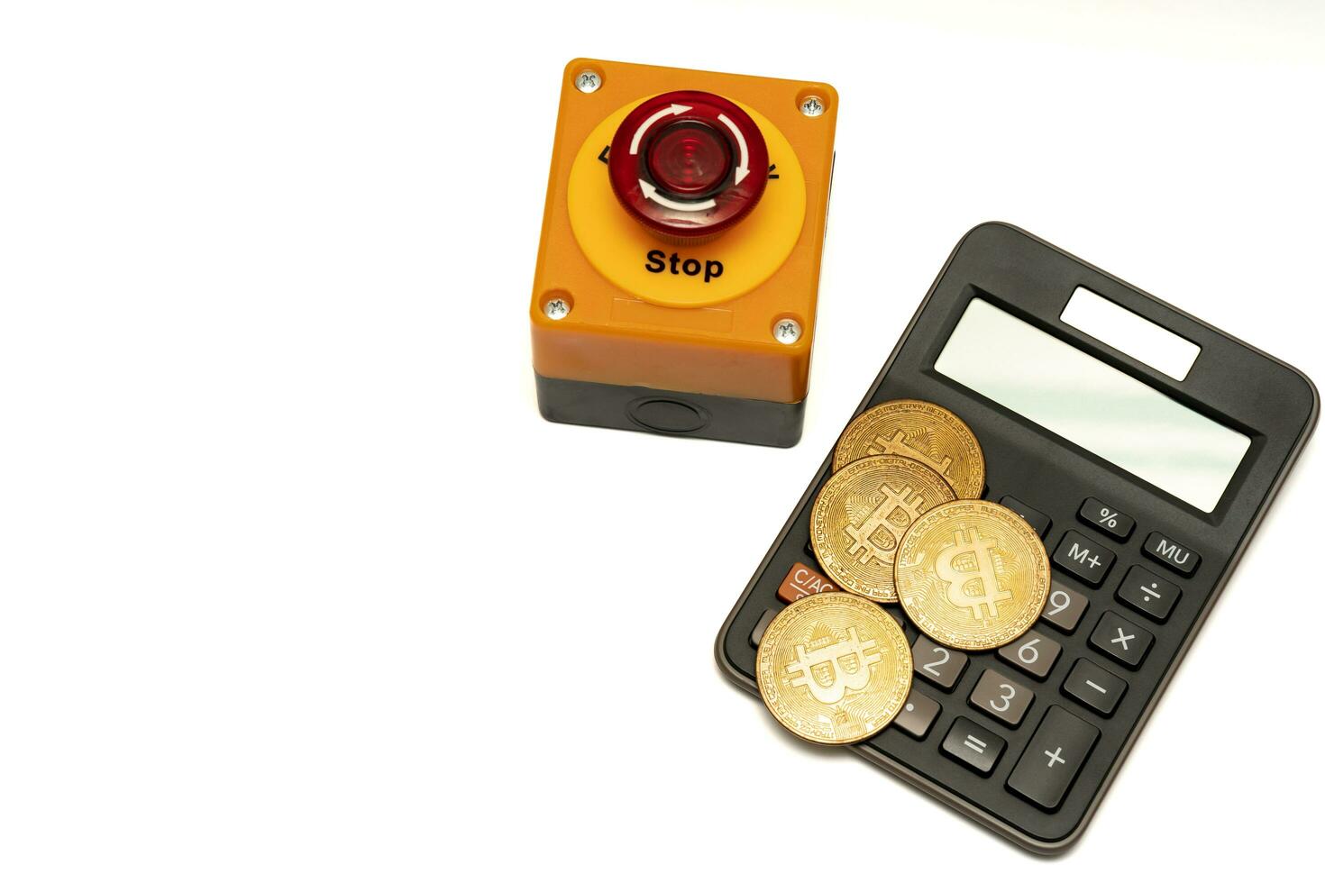 calculator bitcoin and stop button isolated on white background, calculation of profitability. financial disaster and crisis protection when market price fall. photo