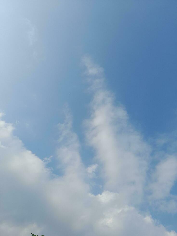 Beautiful white clouds on deep blue sky background. Large bright soft fluffy clouds are cover the entire blue sky. photo