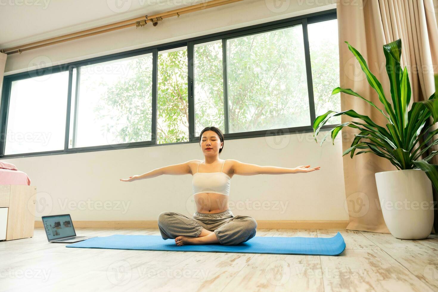 Asian girl exercising at home photo