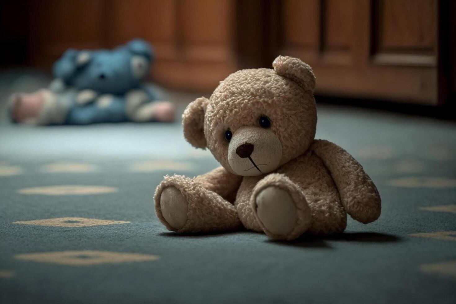 Sad lonely teddy bear lying on the floor symbol of abuse victims photo