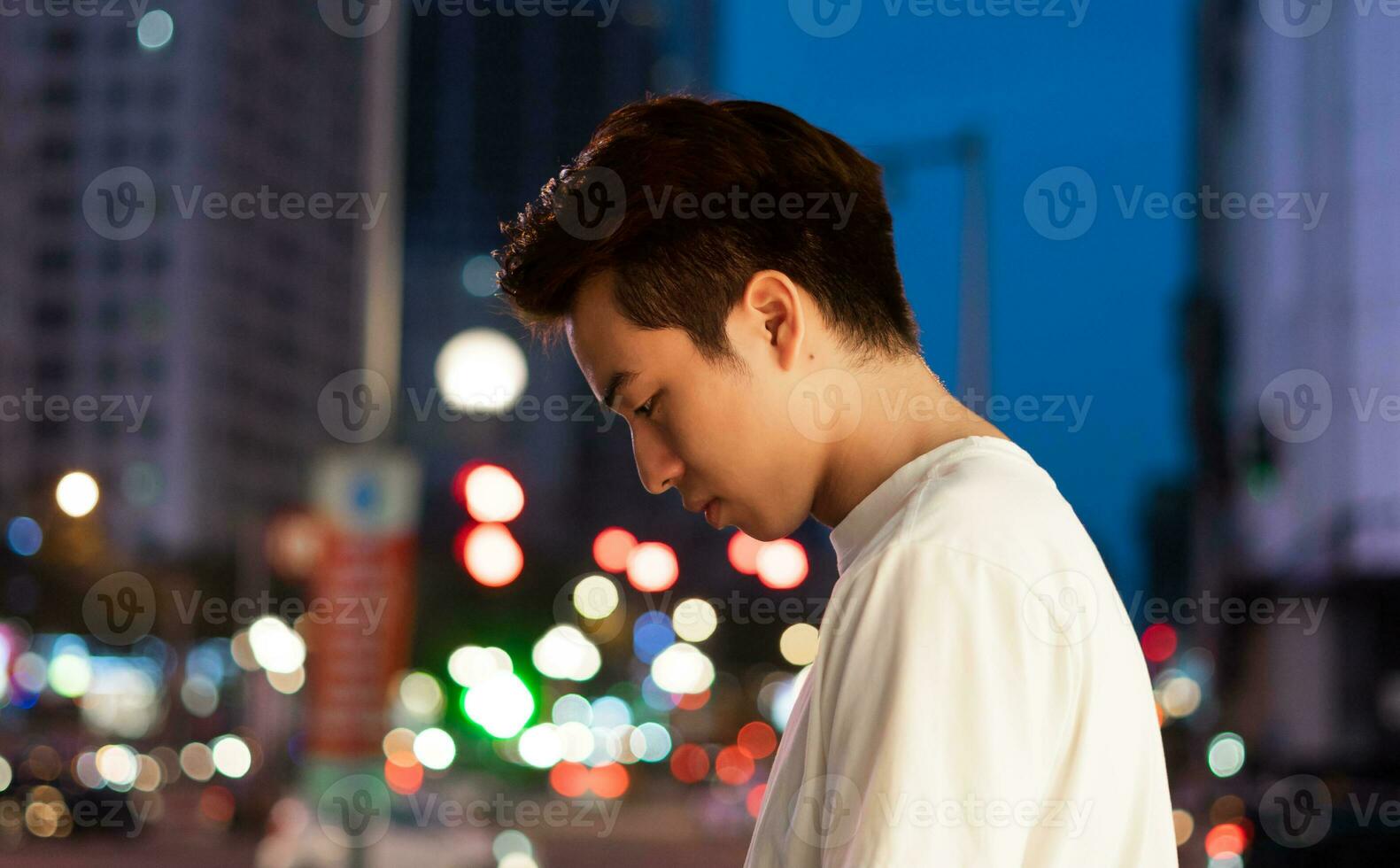 Asian man portrait in the street at night photo