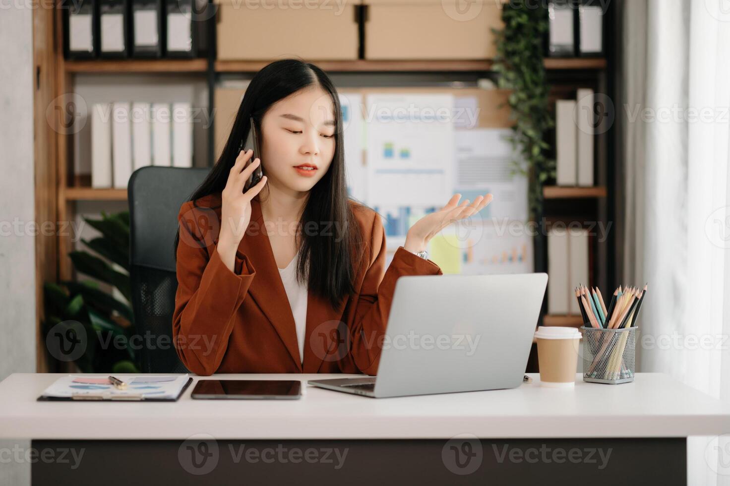 Business woman using tablet and laptop for doing math finance on an office desk, tax, report, accounting, statistics, and analytical research concept photo