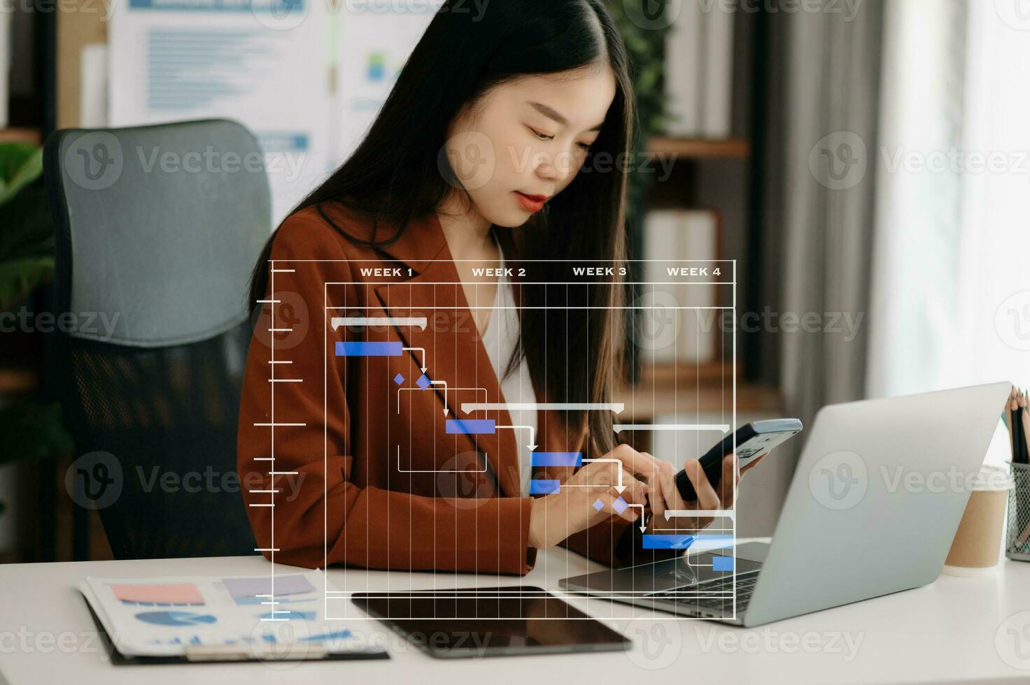 Project manager working and update tasks with milestones progress planning and Gantt chart scheduling diagram. business working with smart phone, tablet and laptop in office. photo