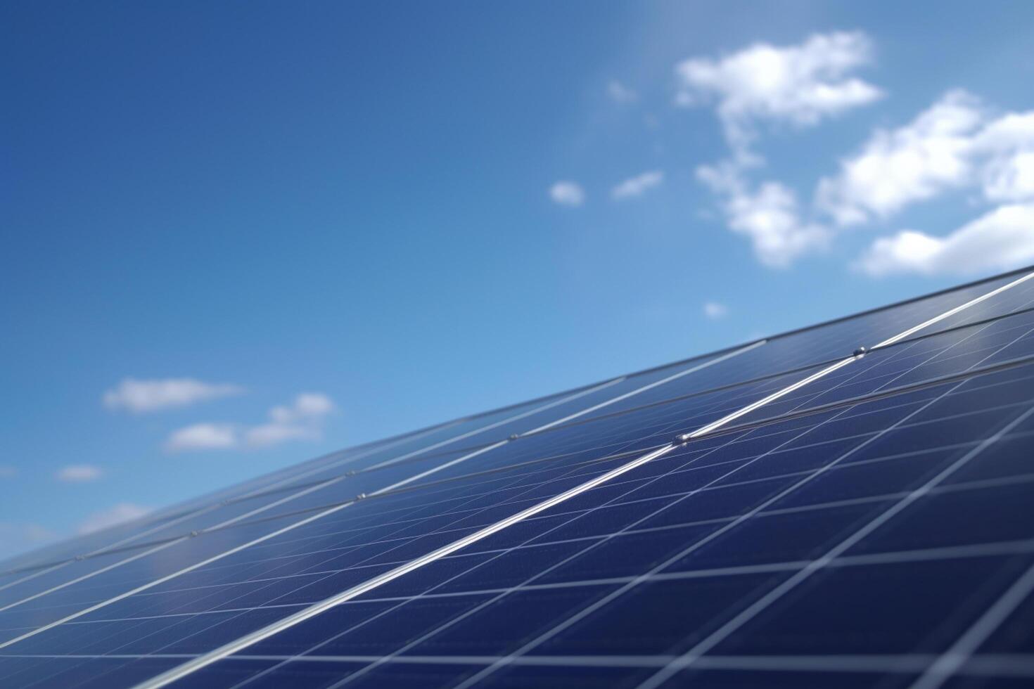 Solar panels on a house roof under blue sky and fluffy clouds photo