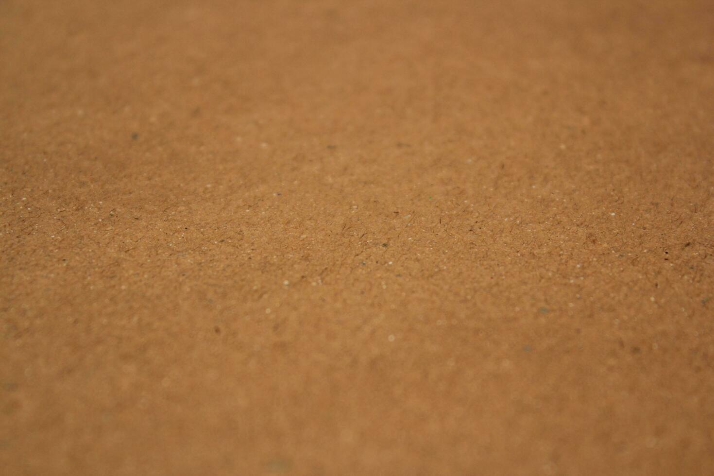 Brown paper texture close detailed background, shiny brown paper surface photo