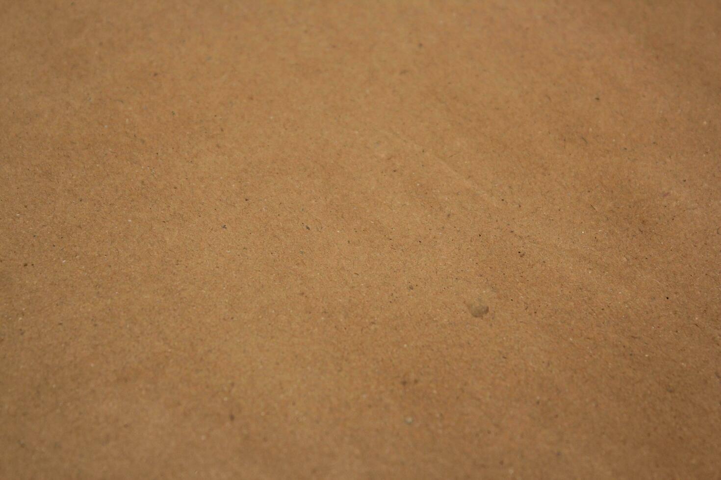 Brown paper texture close detailed background, shiny brown paper surface photo