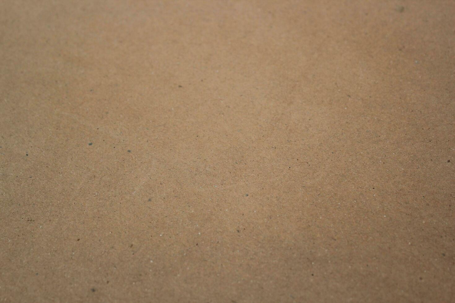 Brown paper texture close detailed background, shiny brown paper surface photo