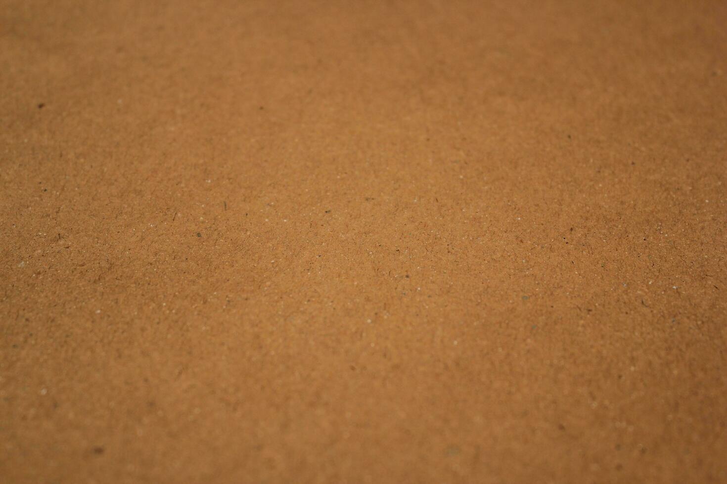 Brown paper texture close detailed background, shiny brown paper surface photo