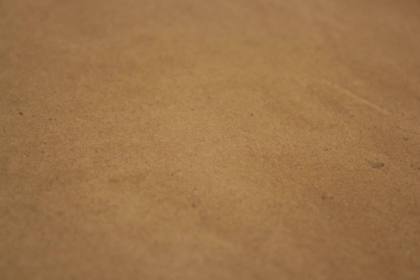 Brown paper texture close detailed background, shiny brown paper surface photo