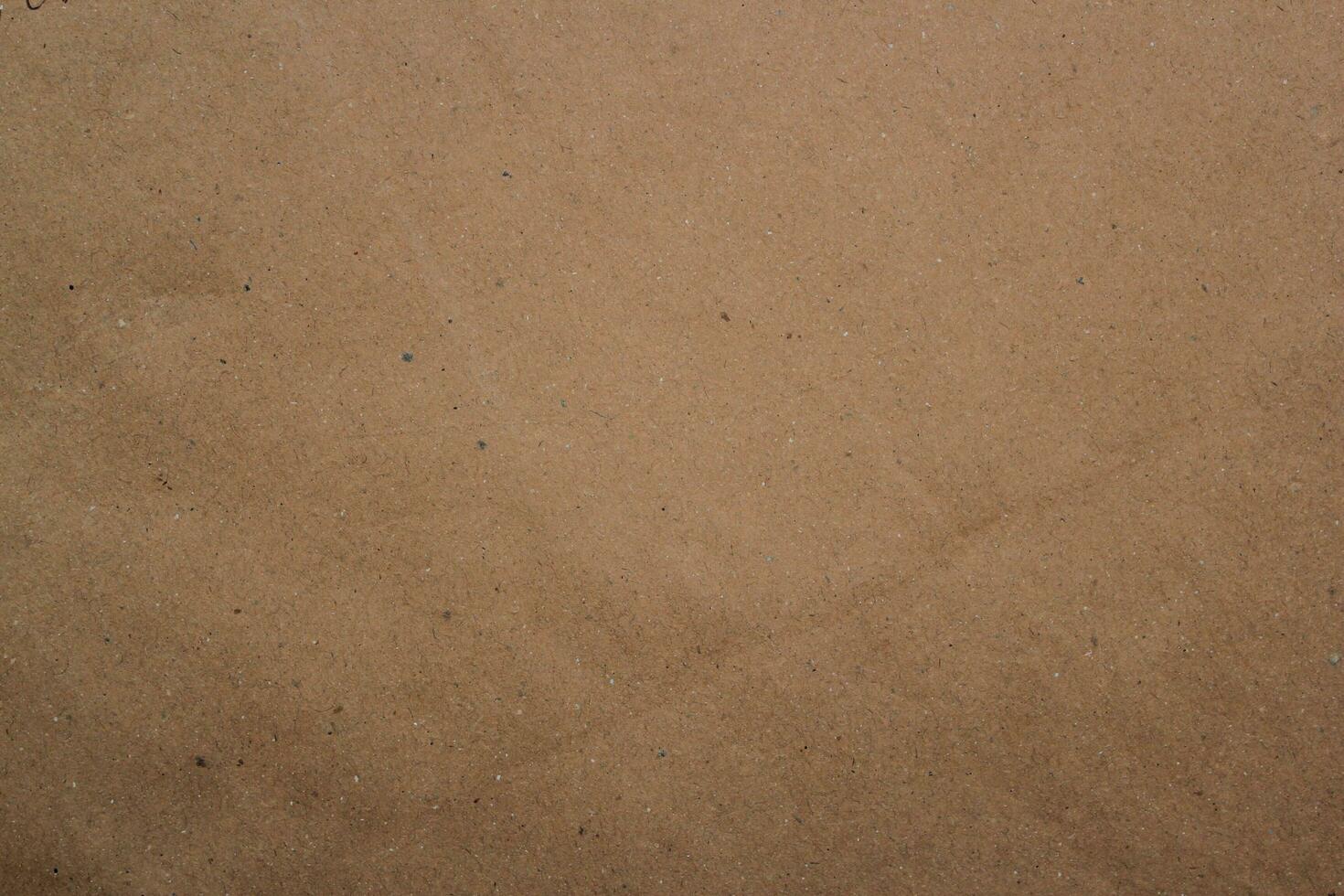 Brown paper texture close detailed background, shiny brown paper surface photo