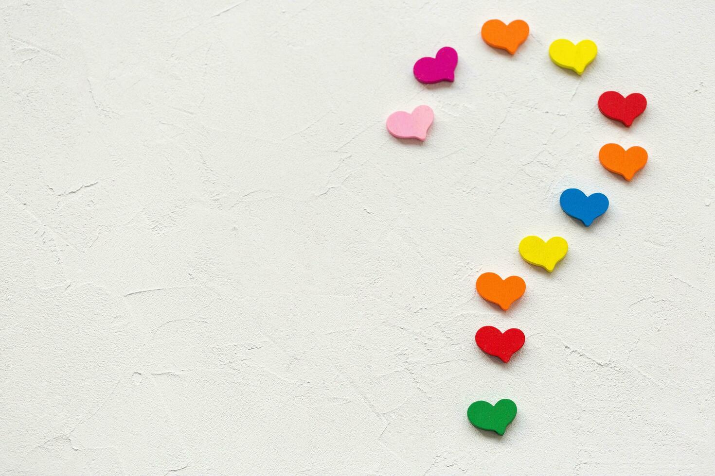 Question mark made of colorful hearts on a white photo