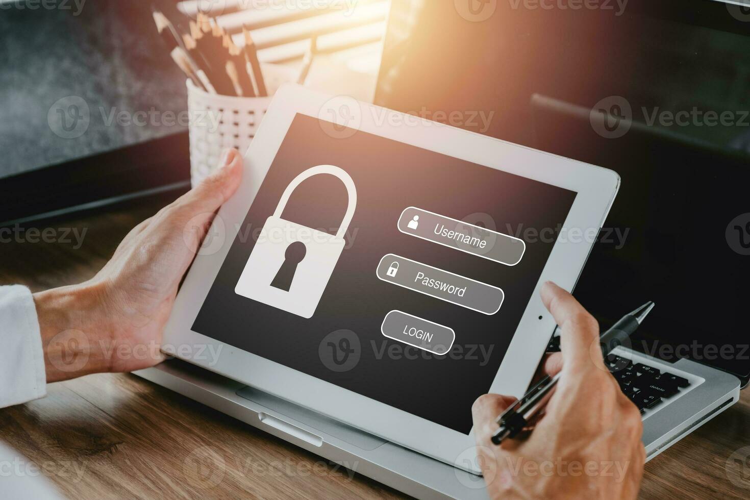 Person hand using digital tablet with login and password on screen display, cyber security concept, data protection and secured internet access.. photo