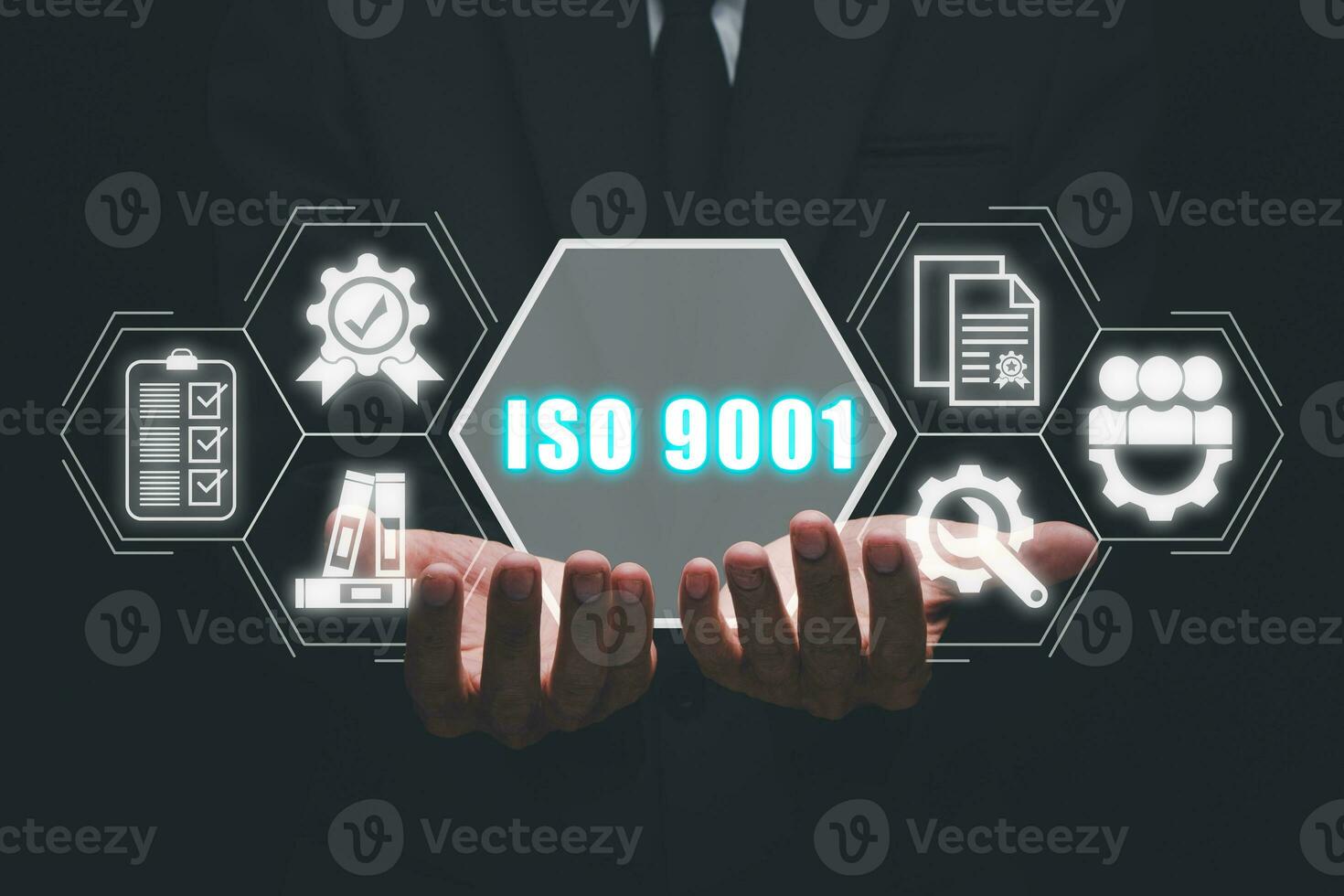 ISO 9001 concept, Businessman hand holding iso 9001 icon on virtual screen. photo