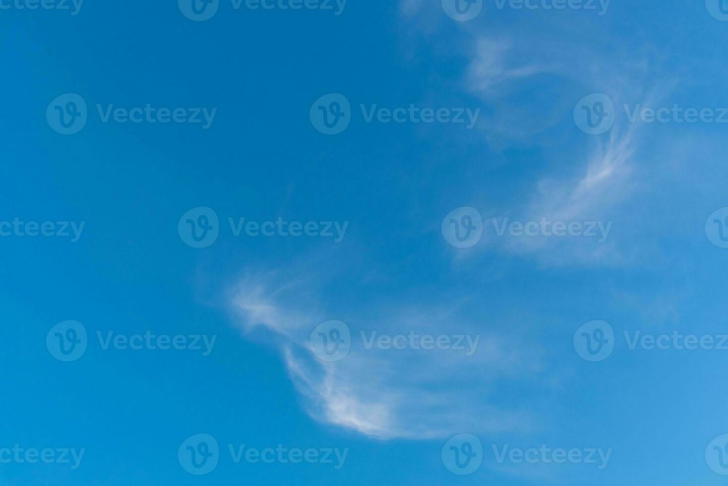 Beautiful cirrus clouds on blue sky background photo