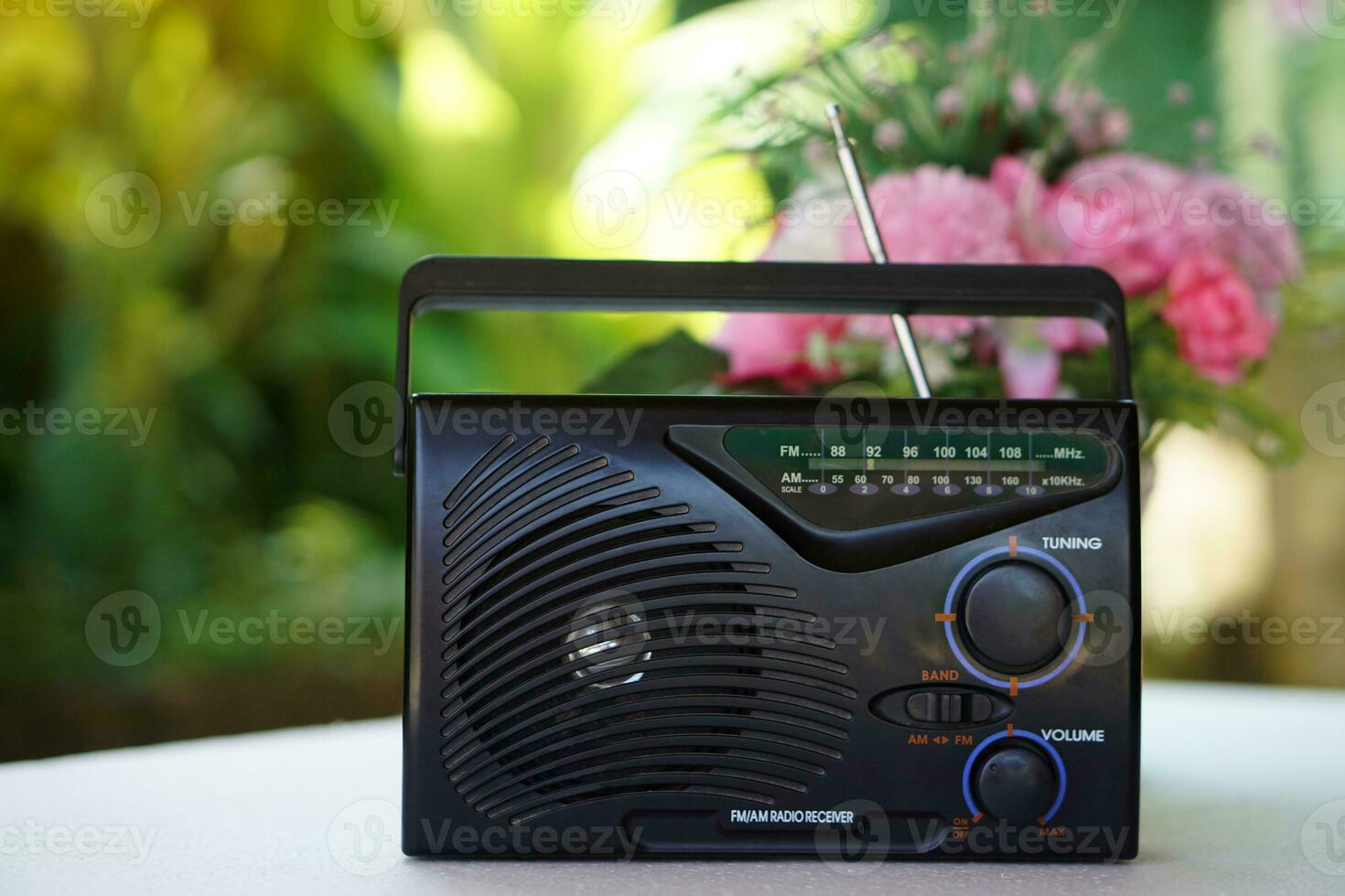 Vintage old transistor radio, placed outdoor. Concept , Analog technology for communication, entertainment, news, songs, music and advertisment photo