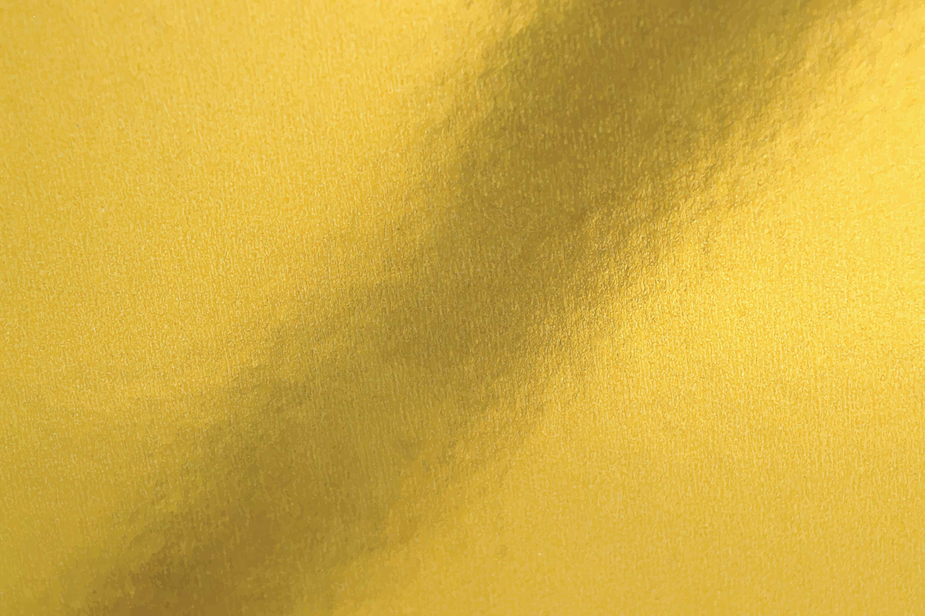 Gold texture background in bright light. Shiny luxury gold color