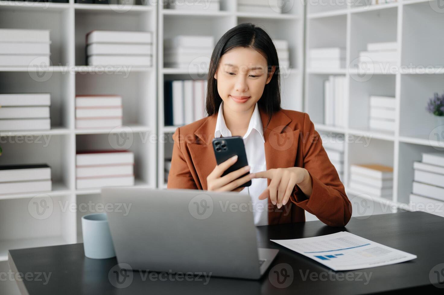 Business woman using tablet and laptop for doing math finance on an office desk, tax, report, accounting, statistics, and analytical research concept in office photo