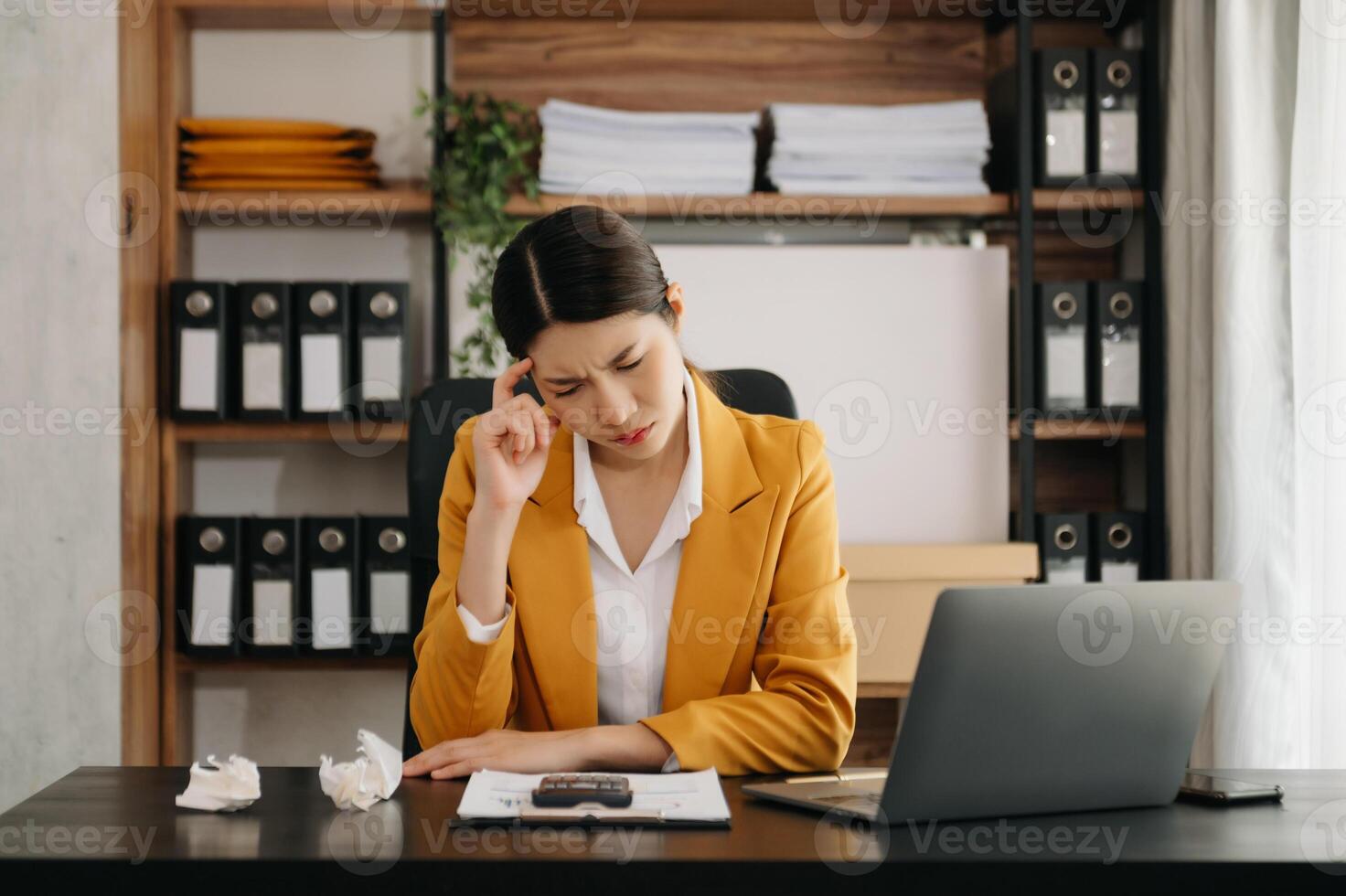 Business woman using tablet and laptop for doing math finance on an office desk, tax, report, accounting, statistics, and analytical research concept in office photo