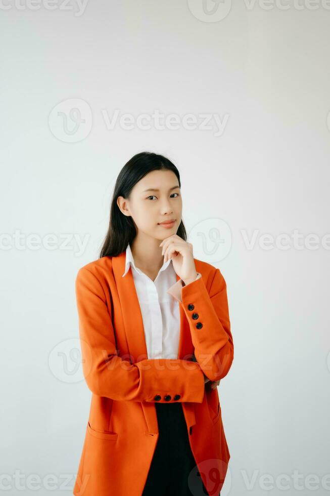 Portrait photo of young beautiful Asian woman feeling happy and holding smart phone, tablet and laptop with black empty screen on white background product presenting concept.