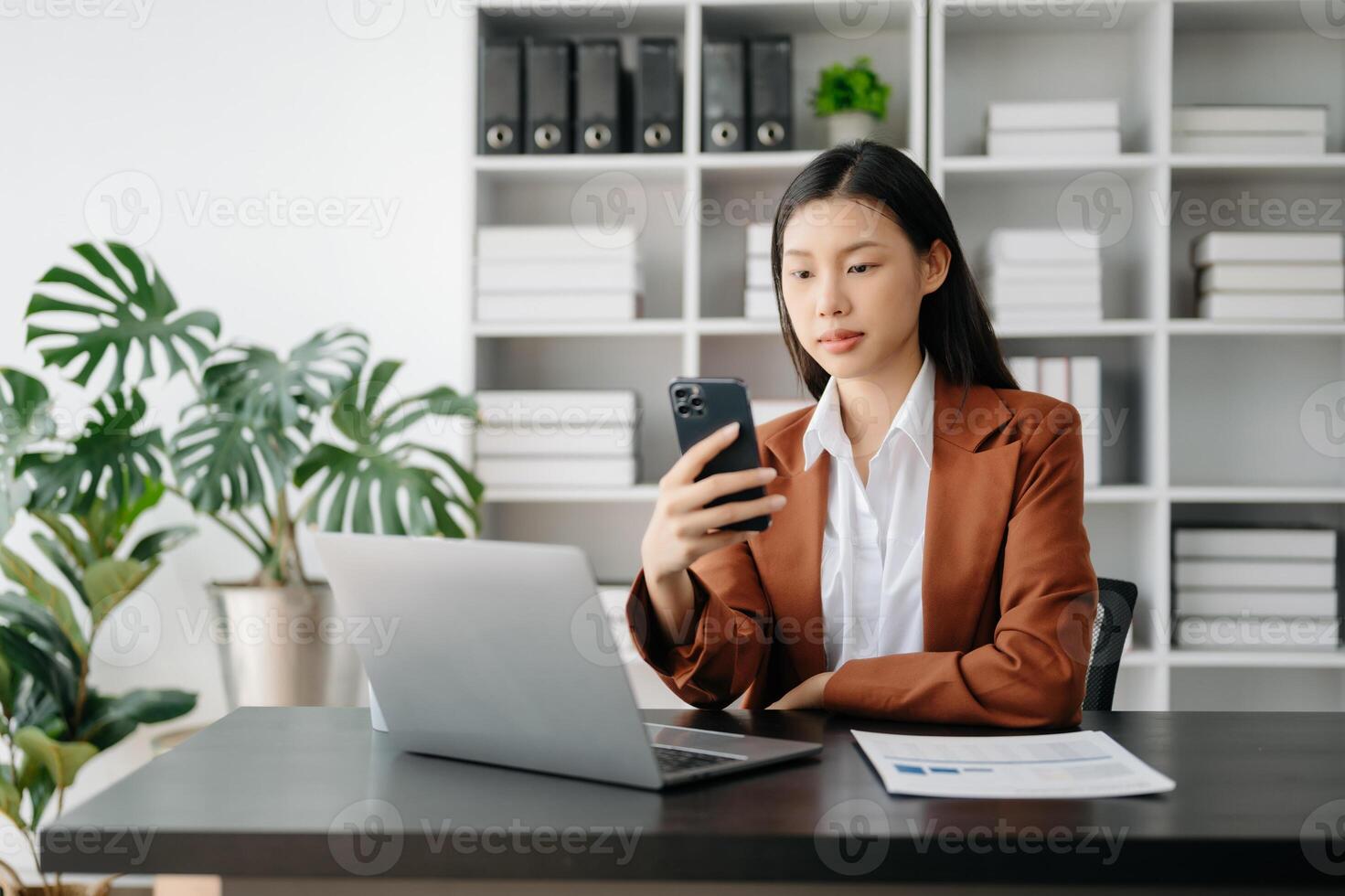 Business woman using tablet and laptop for doing math finance on an office desk, tax, report, accounting, statistics, and analytical research concept in office photo