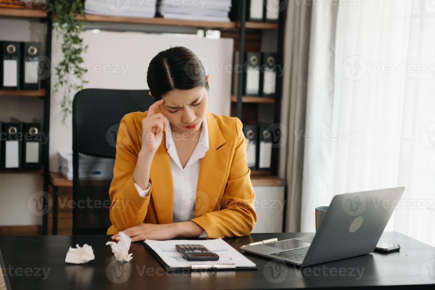 Business woman using tablet and laptop for doing math finance on an office desk, tax, report, accounting, statistics, and analytical research concept in office photo