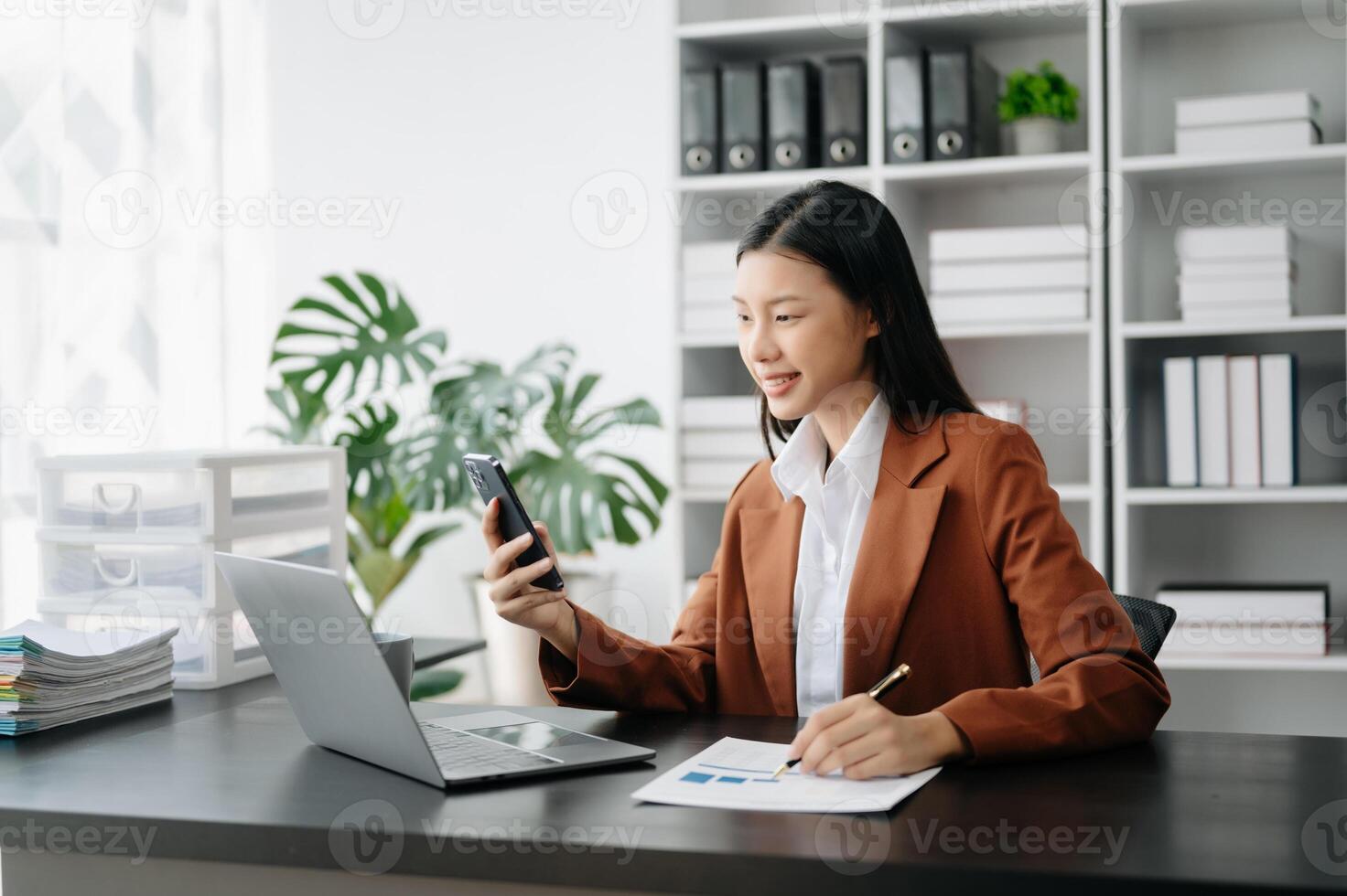 Business woman using tablet and laptop for doing math finance on an office desk, tax, report, accounting, statistics, and analytical research concept in office photo