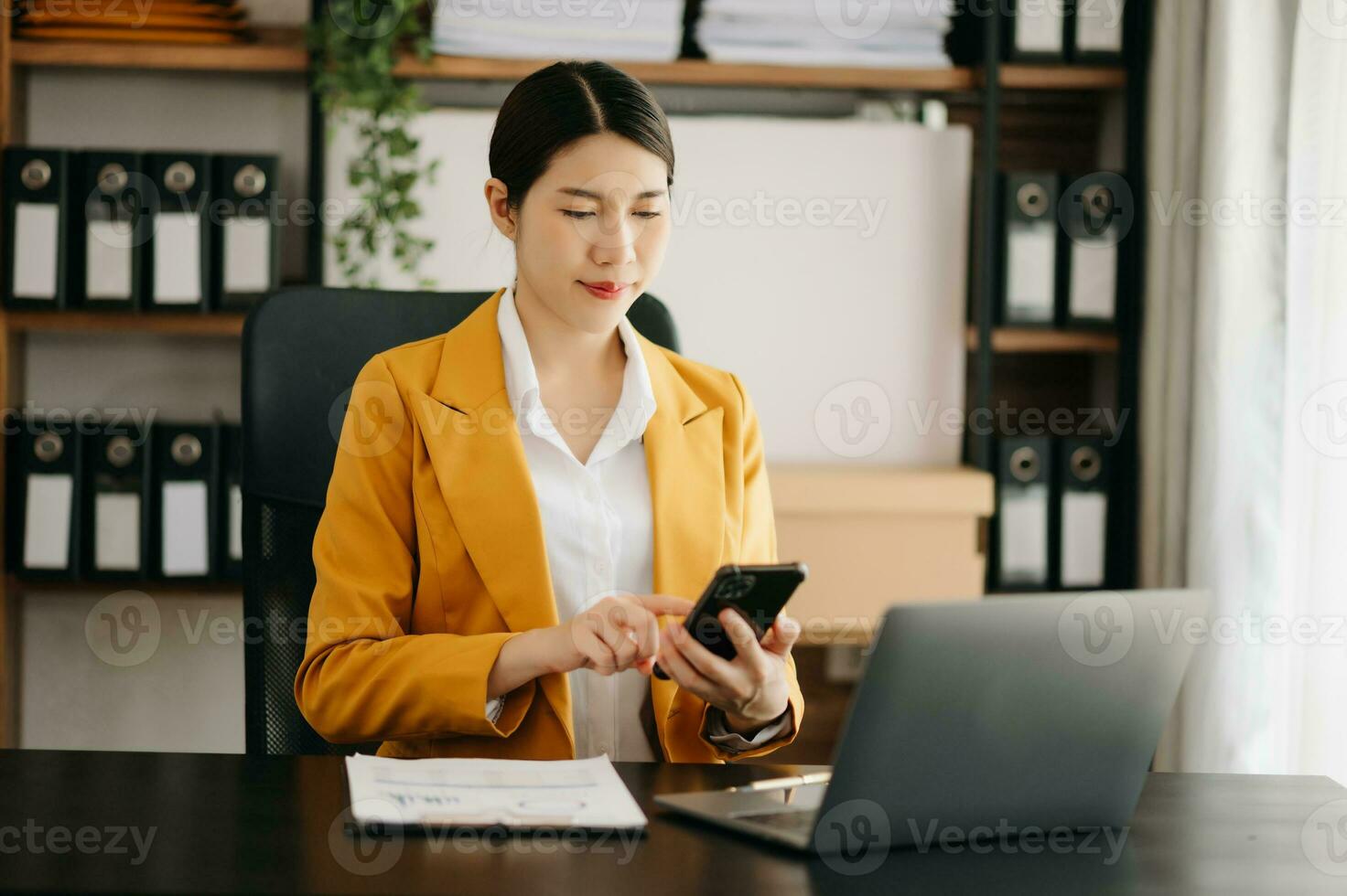Business woman using tablet and laptop for doing math finance on an office desk, tax, report, accounting, statistics, and analytical research concept in office photo