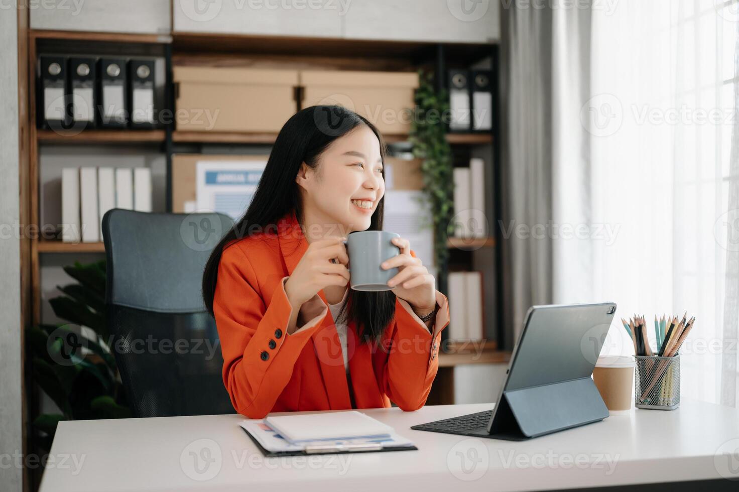 Business woman using tablet and laptop for doing math finance on an office desk, tax, report, accounting, statistics, and analytical research concept photo