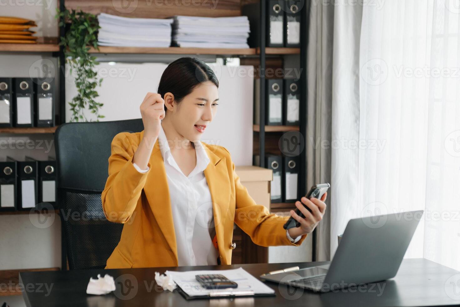 Business woman using tablet and laptop for doing math finance on an office desk, tax, report, accounting, statistics, and analytical research concept in office photo