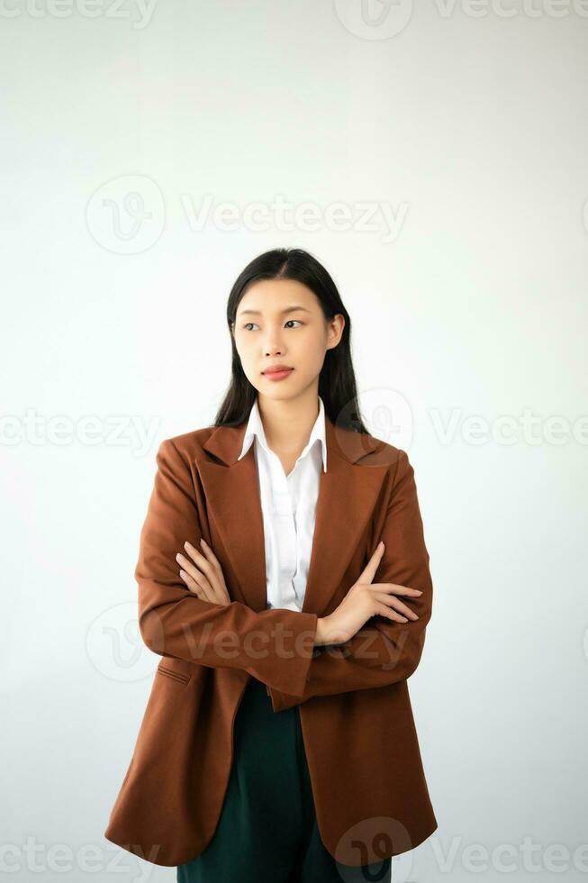 Portrait photo of young beautiful Asian woman feeling happy and holding smart phone, tablet and laptop with black empty screen on white background product presenting concept.