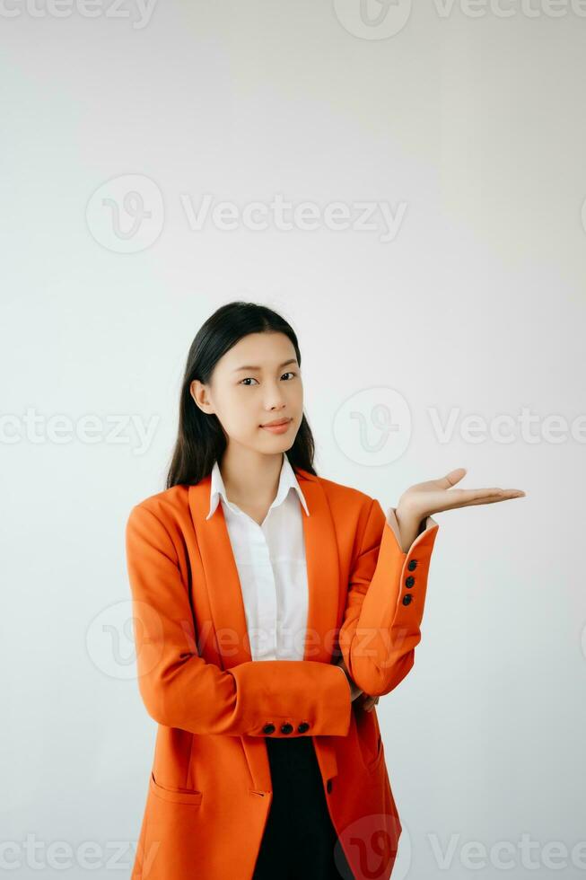 Portrait photo of young beautiful Asian woman feeling happy and holding smart phone, tablet and laptop with black empty screen on white background product presenting concept.