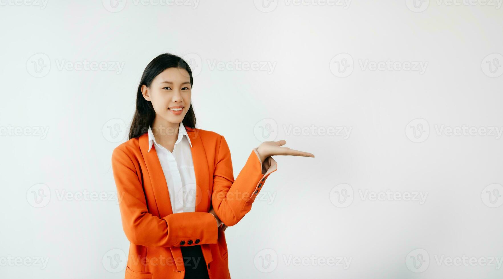 Portrait photo of young beautiful Asian woman feeling happy and holding smart phone, tablet and laptop with black empty screen on white background product presenting concept.