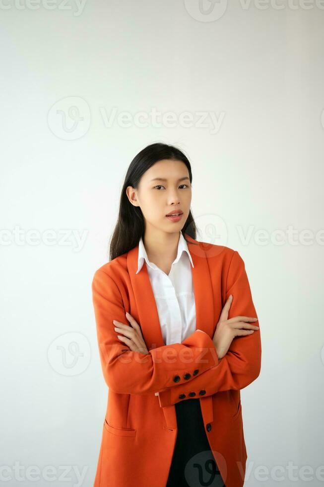 Portrait photo of young beautiful Asian woman feeling happy and holding smart phone, tablet and laptop with black empty screen on white background product presenting concept.