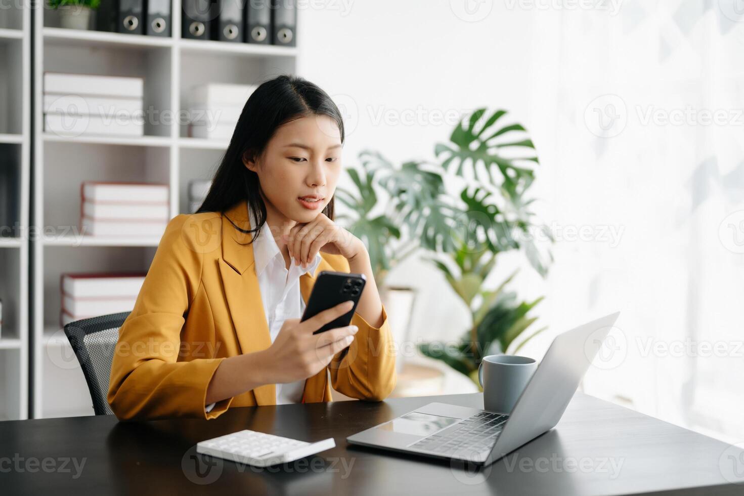 Business woman using tablet and laptop for doing math finance on an office desk, tax, report, accounting, statistics, and analytical research concept in office photo