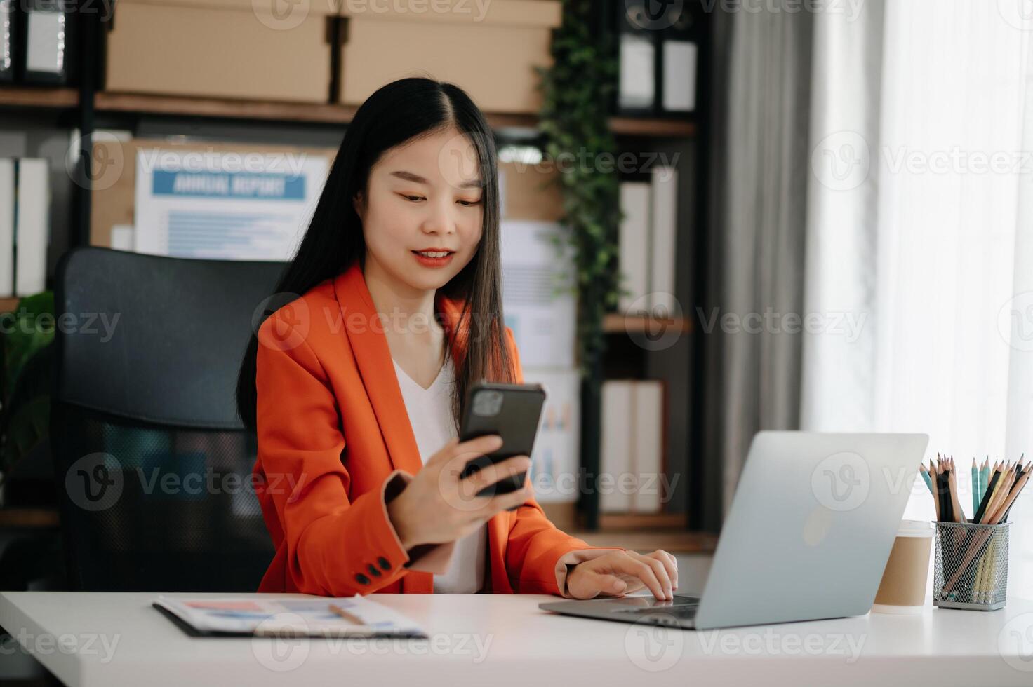 Business woman using tablet and laptop for doing math finance on an office desk, tax, report, accounting, statistics, and analytical research concept photo