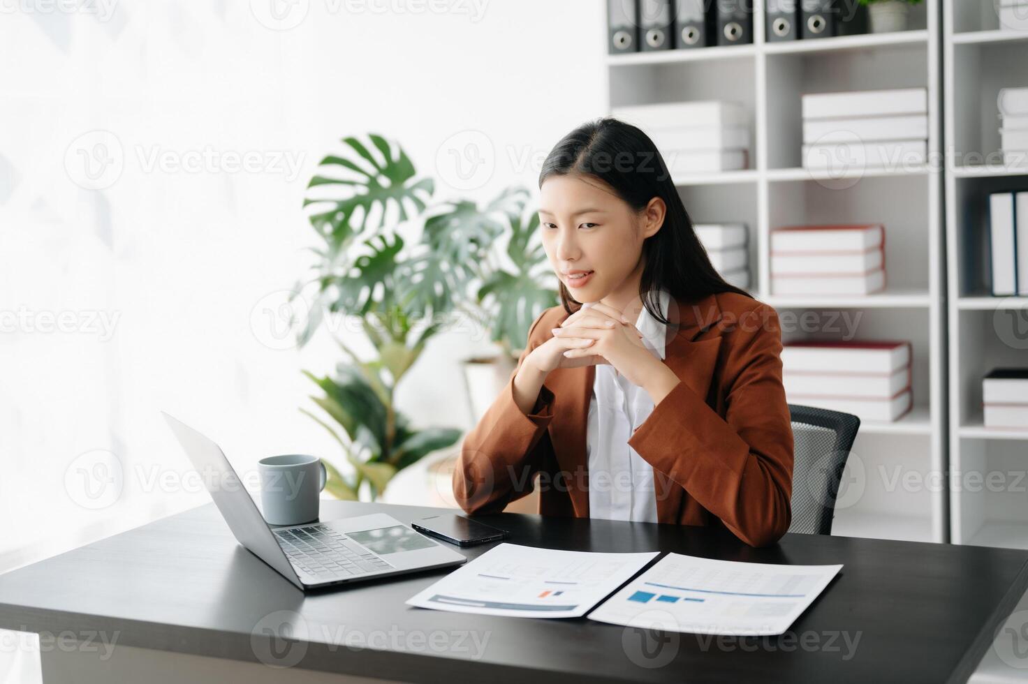 Business woman using tablet and laptop for doing math finance on an office desk, tax, report, accounting, statistics, and analytical research concept in office photo