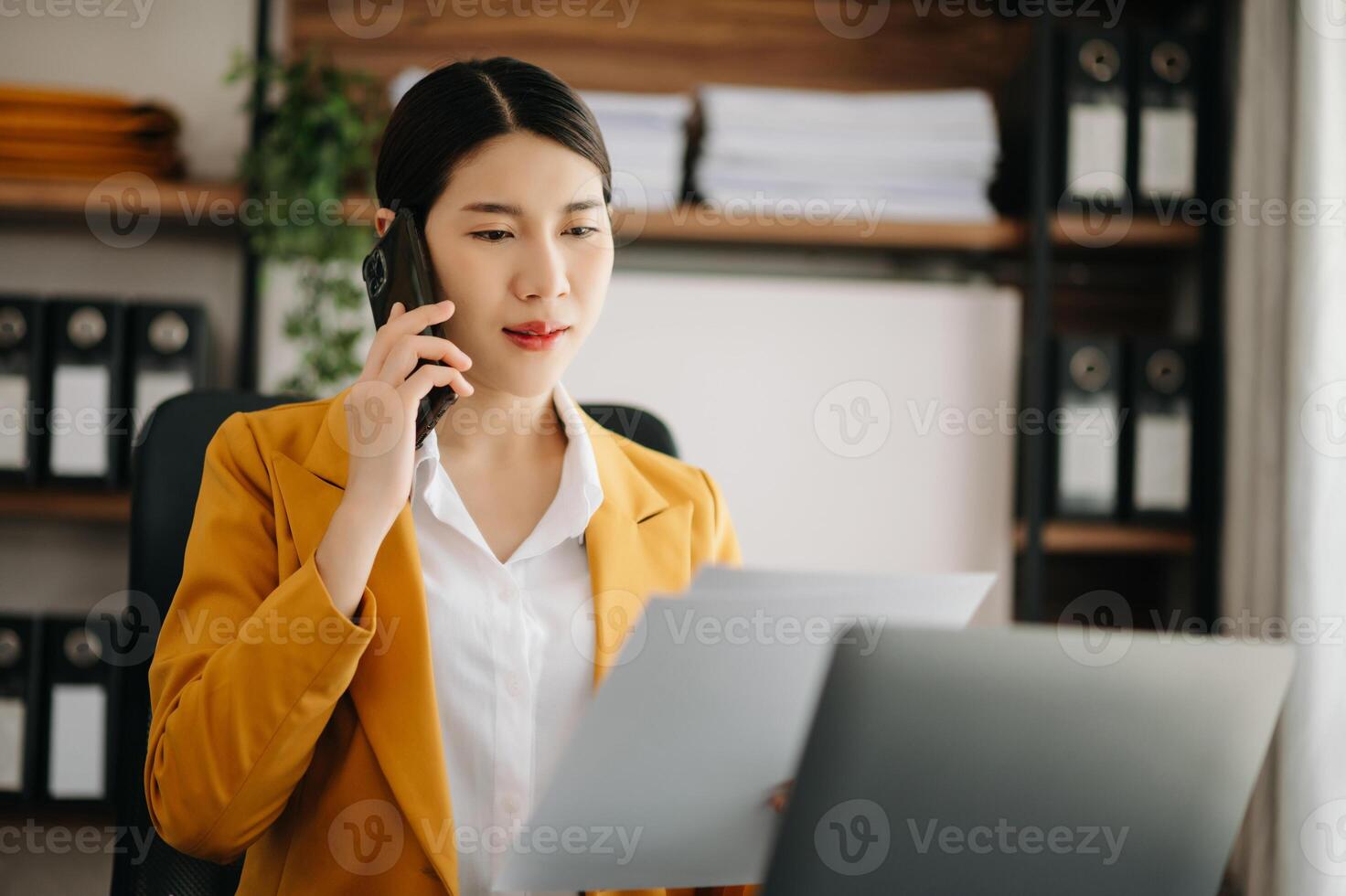 Business woman using tablet and laptop for doing math finance on an office desk, tax, report, accounting, statistics, and analytical research concept in office photo