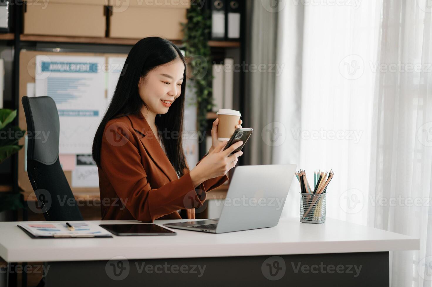 Business woman using tablet and laptop for doing math finance on an office desk, tax, report, accounting, statistics, and analytical research concept photo