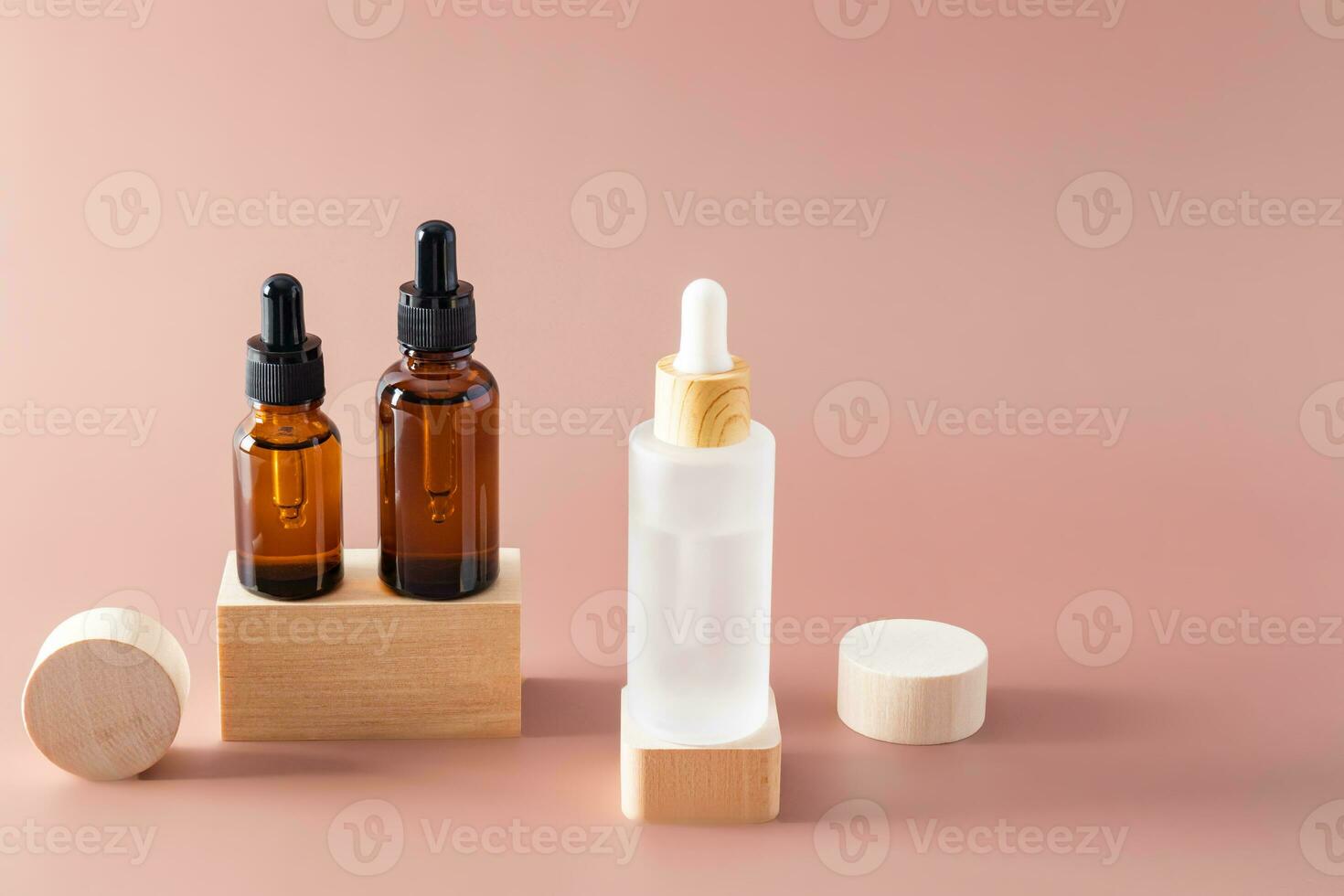 Luxurious cosmetic bottles with anti-aging skin care products for the face and body stand on wooden geometric shapes, catwalks. Product presentation. photo