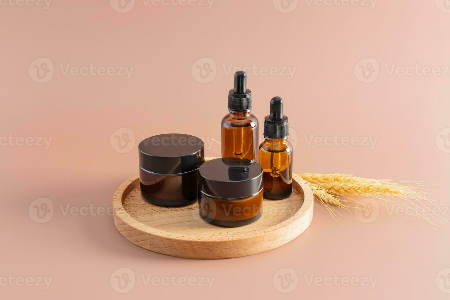 cosmetic packaging. A set of various cosmetic bottles for cream and serum on a brown wooden tray. Blank packing. natural cosmetics. photo