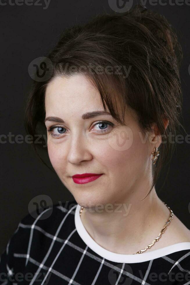 Portrait of a beautiful middle-aged woman. A woman of thirty or thirty-five. photo