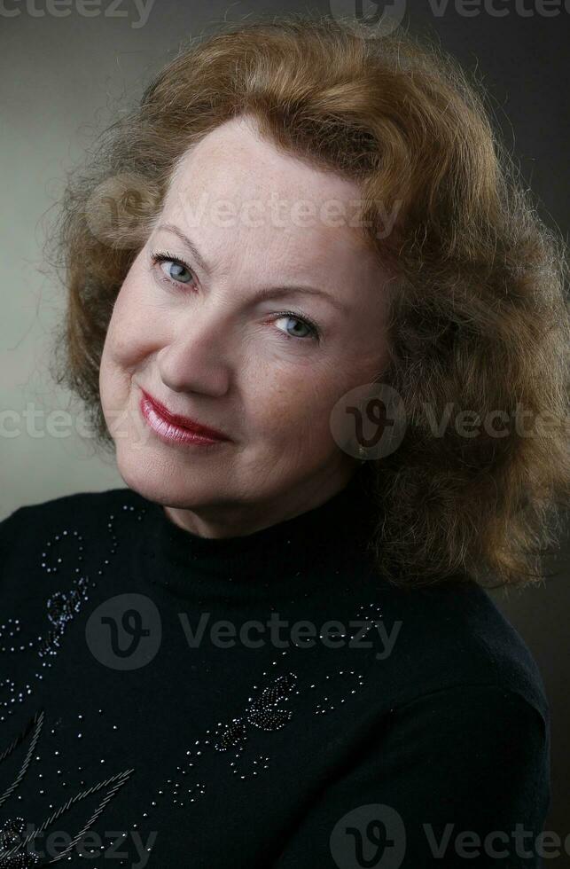 Portrait of a beautiful elderly woman. Sweet grandmother. photo