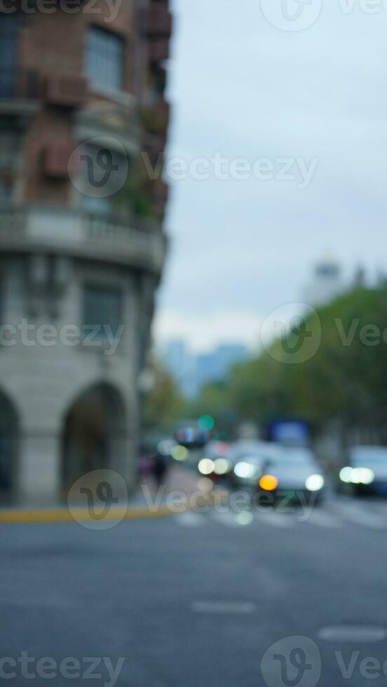 The blurred road view with the green trees along the both sides in Shanghai in summer photo