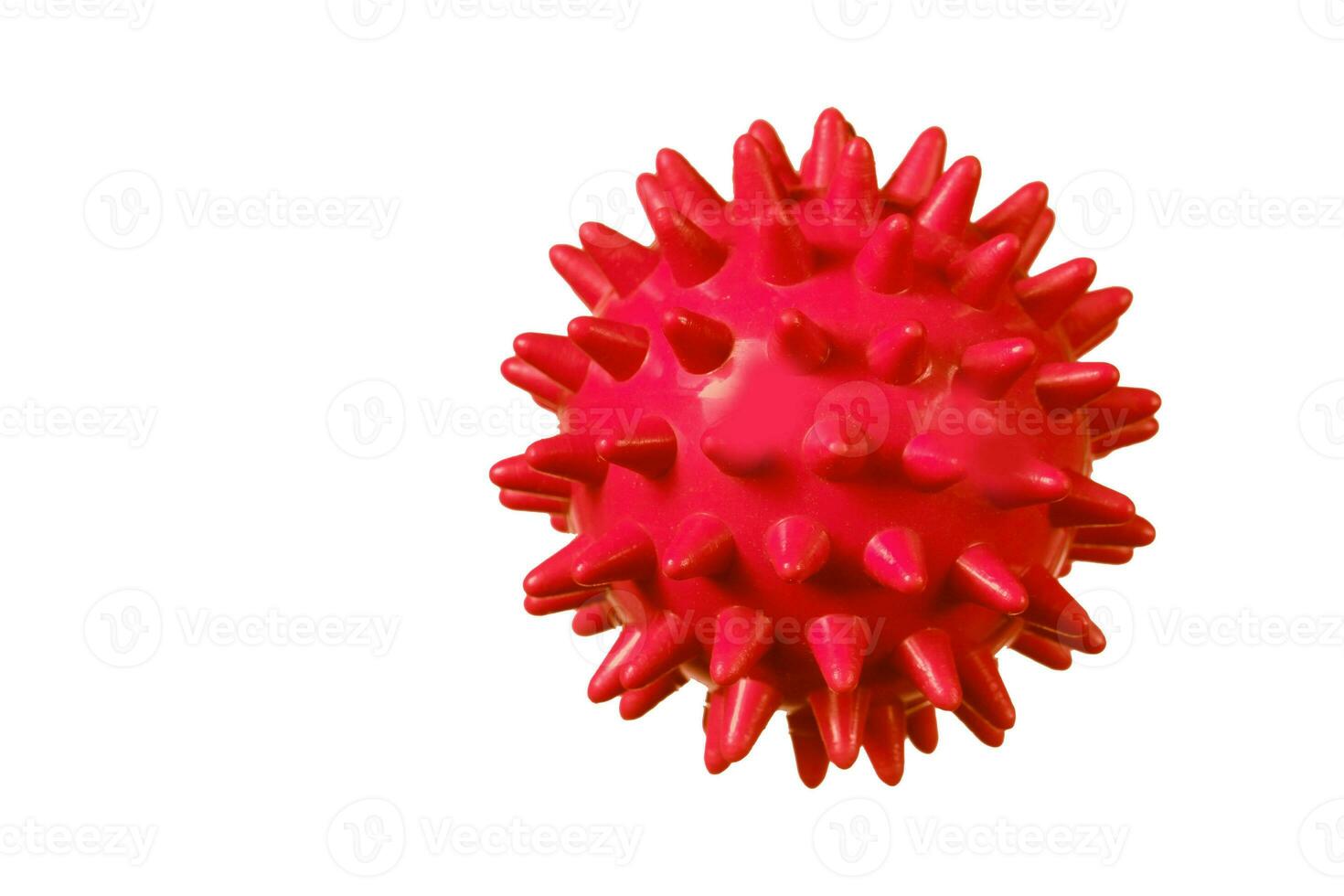 Red rubber ball with spikes on a white background. photo
